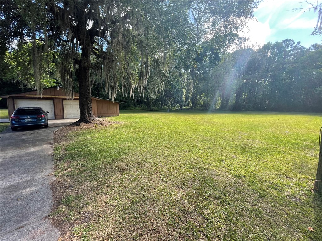 45013 Bismark Road Callahan, FL 32011 - Photo 16 of 26 a view of a car park next to a yard