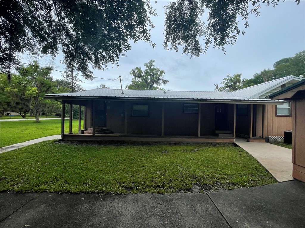 45013 Bismark Road Callahan, FL 32011 - Photo 17 of 26 a view of a house with a yard