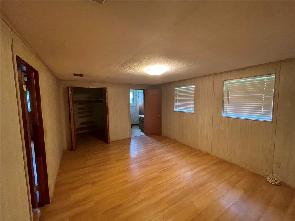 45013 Bismark Road Callahan, FL 32011 - Photo 19 of 26 wooden floor in an empty room with a window