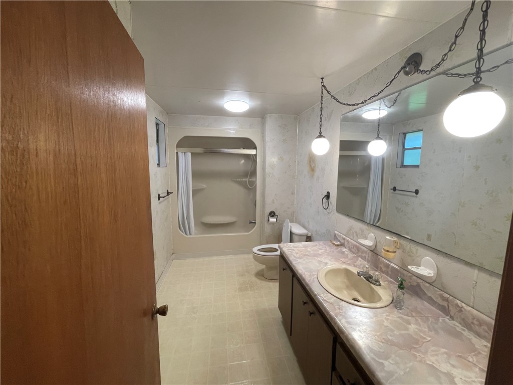 45013 Bismark Road Callahan, FL 32011 - Photo 20 of 26 a bathroom with a sink a toilet and shower