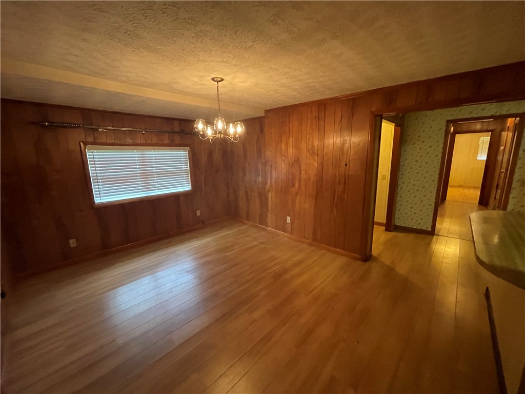 45013 Bismark Road Callahan, FL 32011 - Photo 23 of 26 an empty room with wooden floor and windows