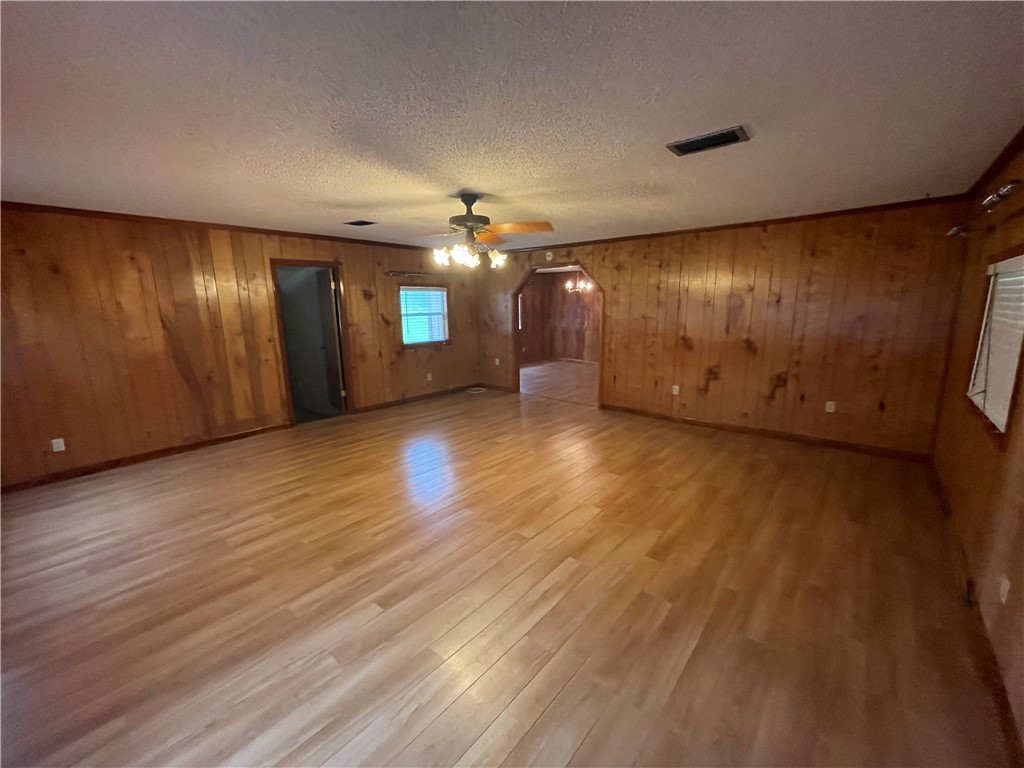 45013 Bismark Road Callahan, FL 32011 - Photo 24 of 26 a view of an empty room with wooden floor and windows