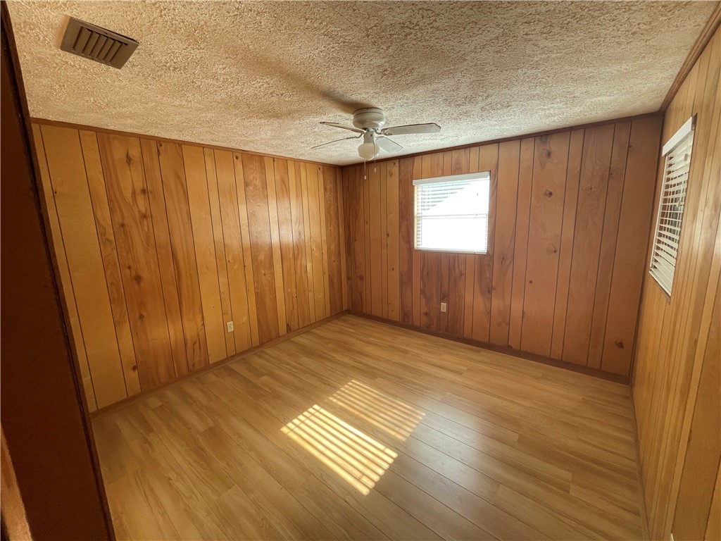 45013 Bismark Road Callahan, FL 32011 - Photo 4 of 26 a view of an empty room with wooden floor