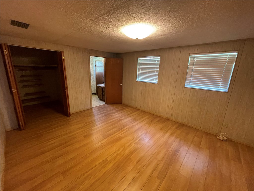 45013 Bismark Road Callahan, FL 32011 - Photo 5 of 26 a view of an empty room with wooden floor and closet