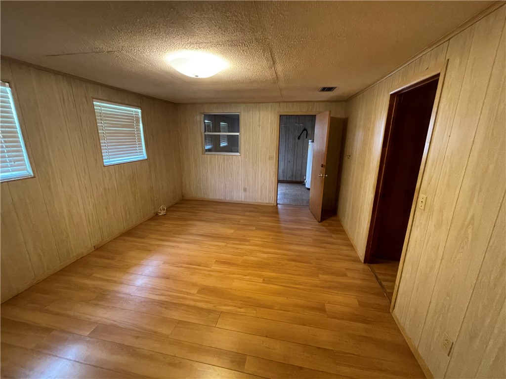 45013 Bismark Road Callahan, FL 32011 - Photo 8 of 26 wooden floor in an empty room with a window