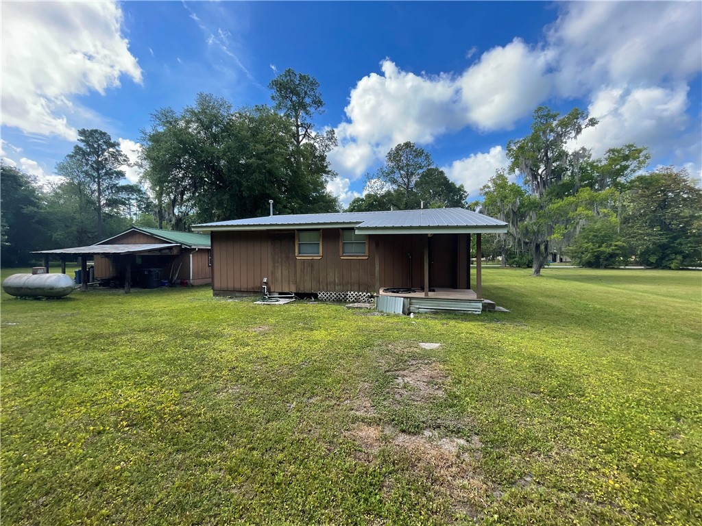 45013 Bismark Road Callahan, FL 32011 - Photo 10 of 26 a view of a house with backyard and garden