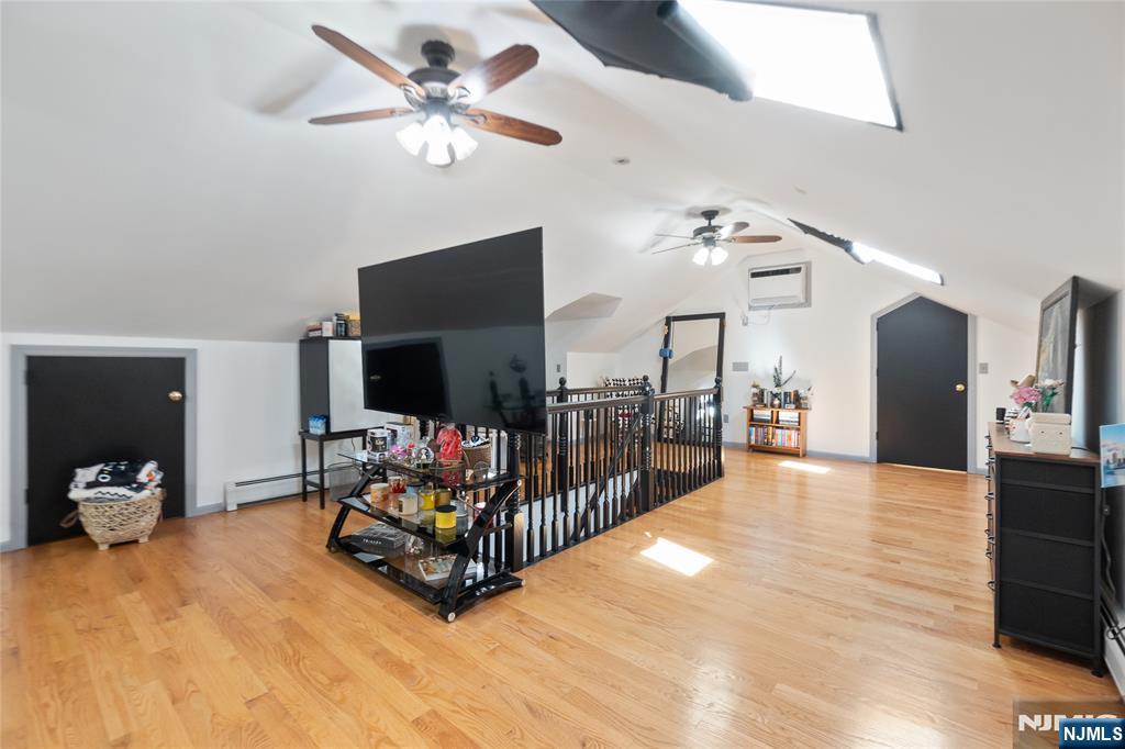 120 South Prospect Avenue Hackensack, NJ 07601 - Photo 11 of 24 a living room with furniture and a flat screen tv