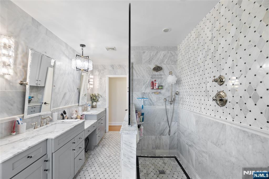 120 South Prospect Avenue Hackensack, NJ 07601 - Photo 14 of 24 a spacious bathroom with a double vanity sink mirror and shower