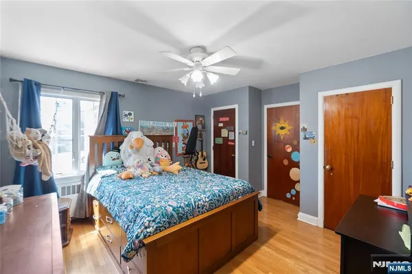 a bed room with furniture and window