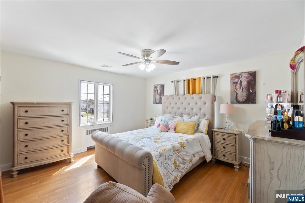 120 South Prospect Avenue Hackensack, NJ 07601 - Photo 7 of 24 a bedroom with a bed and a dresser