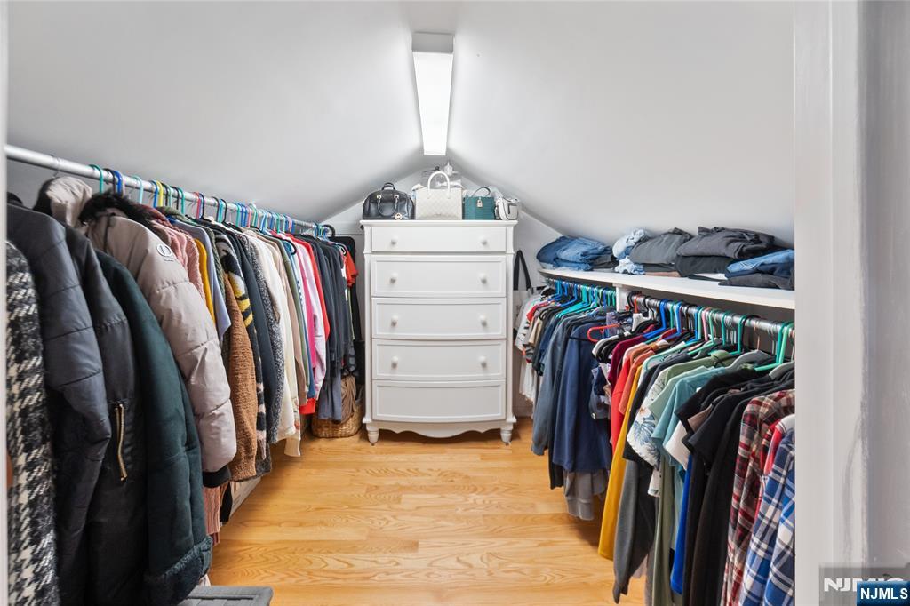 120 South Prospect Avenue Hackensack, NJ 07601 - Photo 8 of 24 a view of walk in closet with clothes and shoes