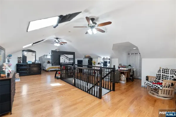 a living room with lots of furniture and kitchen view