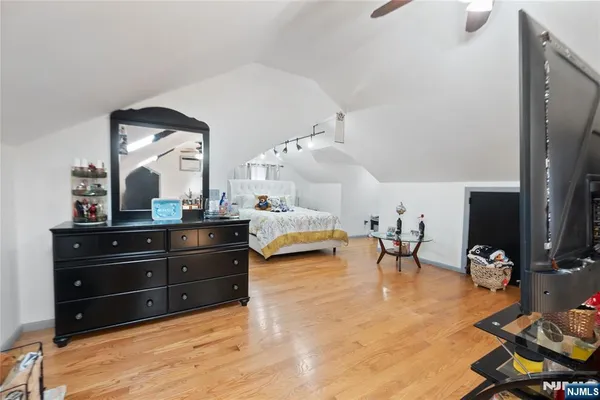 a living room with furniture and a mirror