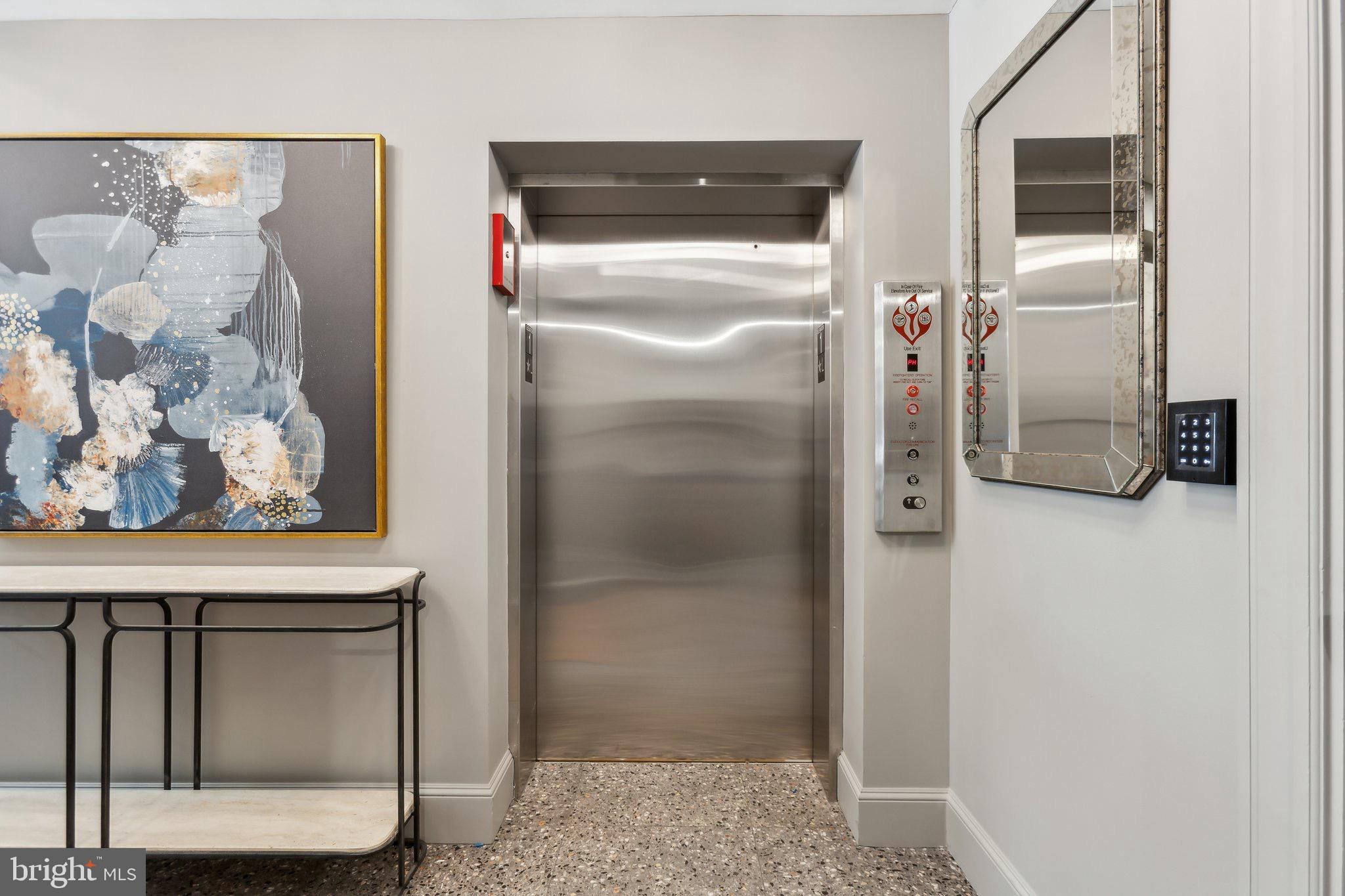 1641 R Street Northwest, Unit 401 Washington, DC 20009 - Photo 29 of 36 Modern elevator entrance with artistic flair.