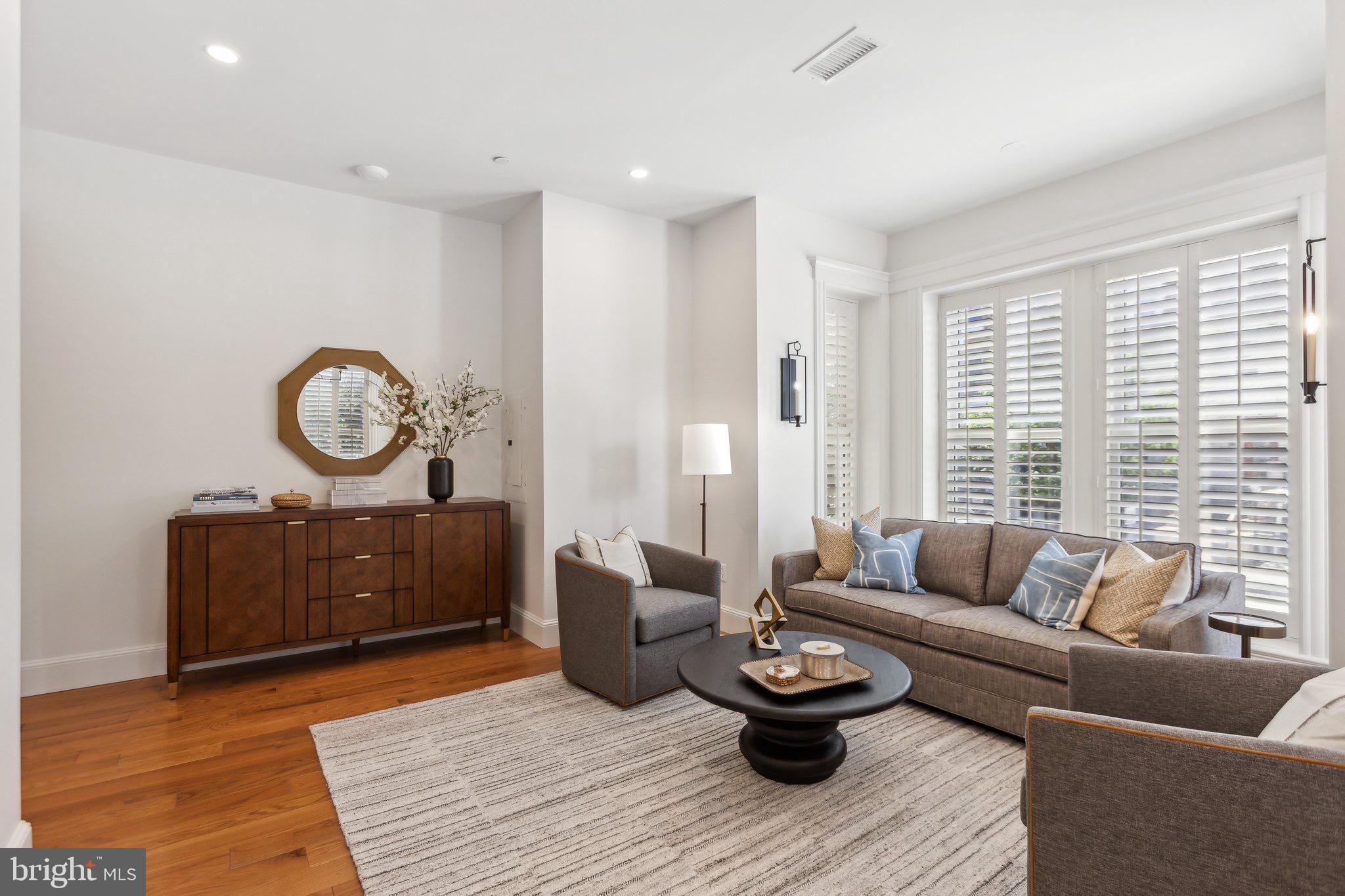 1641 R Street Northwest, Unit 401 Washington, DC 20009 - Photo 3 of 36 Modern elegance in a sunlit living space.