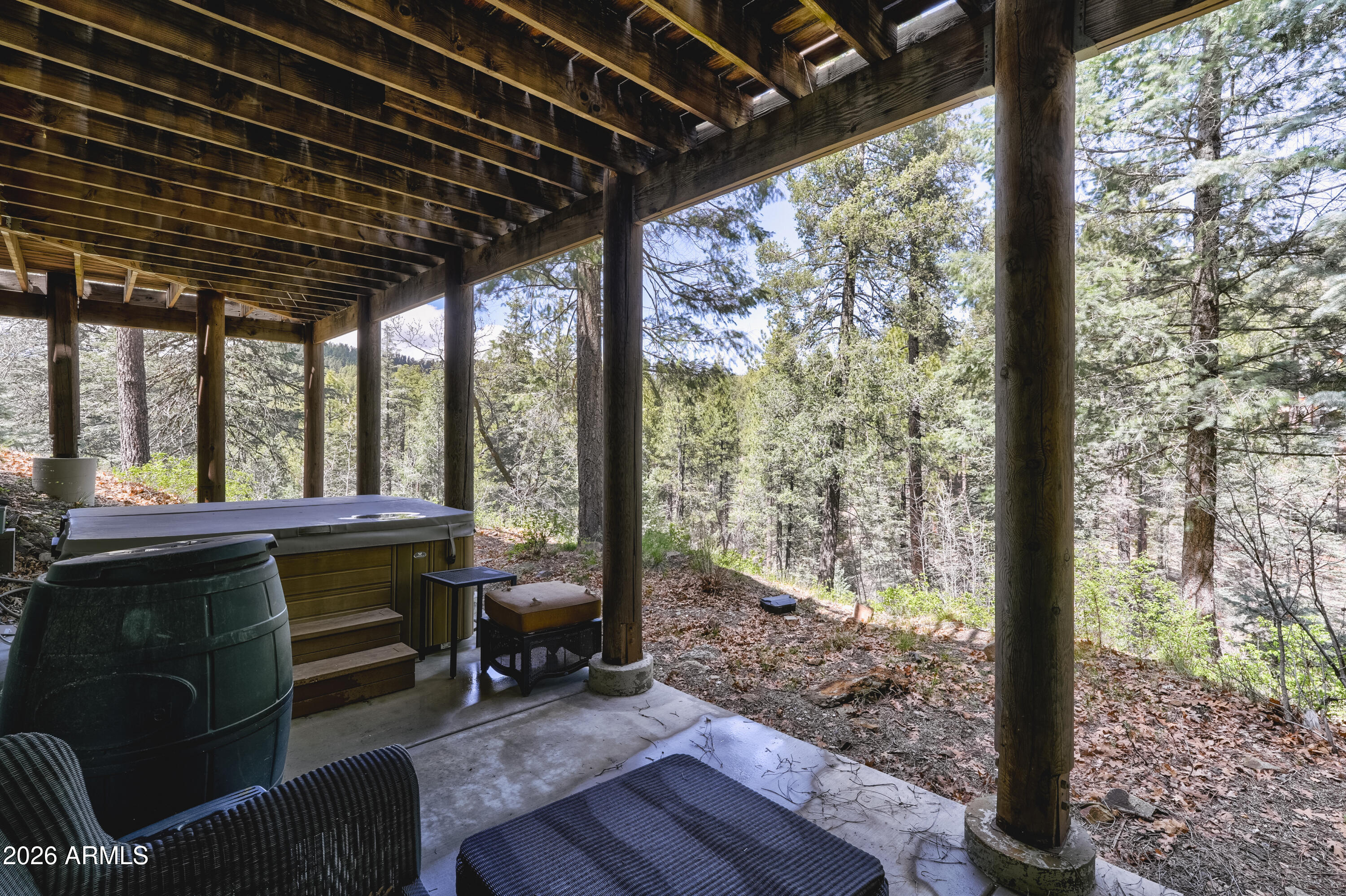 8105 South Comstock Mine Road Prescott, AZ 86303 - Photo 40 of 62 a view of a porch with furniture and wooden floor