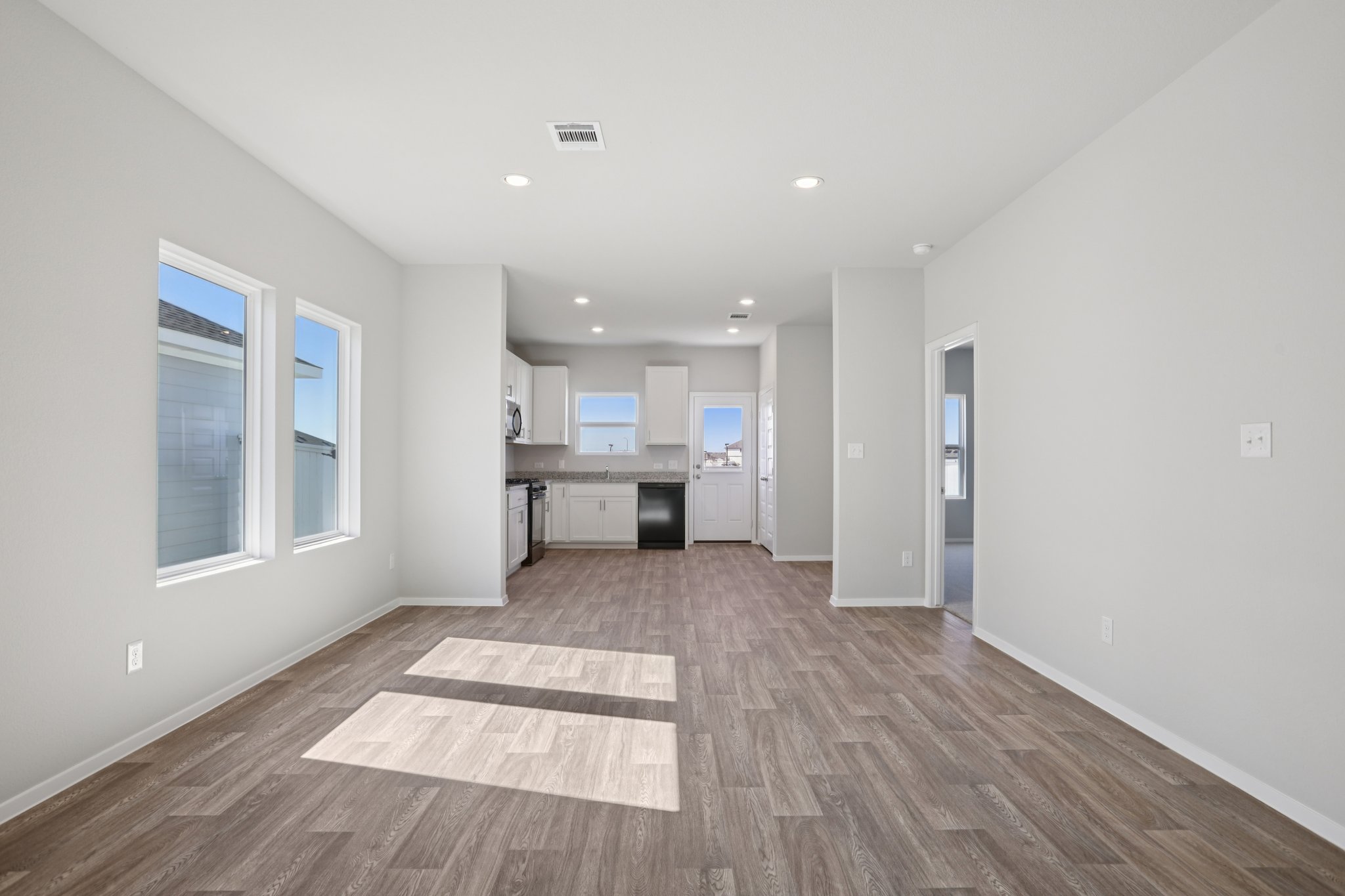 134 Summer Drive Elgin, TX 78621 - Photo 13 of 40 From Family Room to Open Concept Kitchen