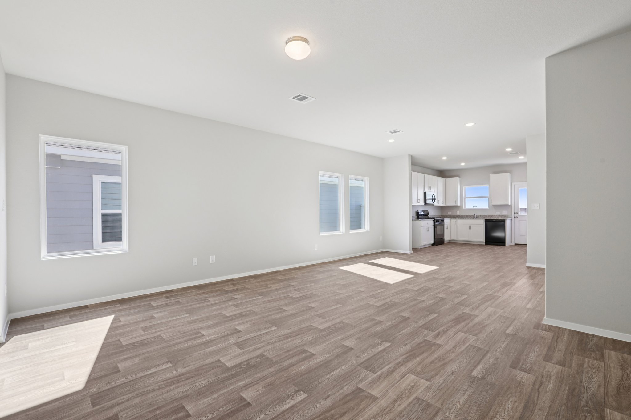 134 Summer Drive Elgin, TX 78621 - Photo 14 of 40 From Family Room to Open Concept Kitchen