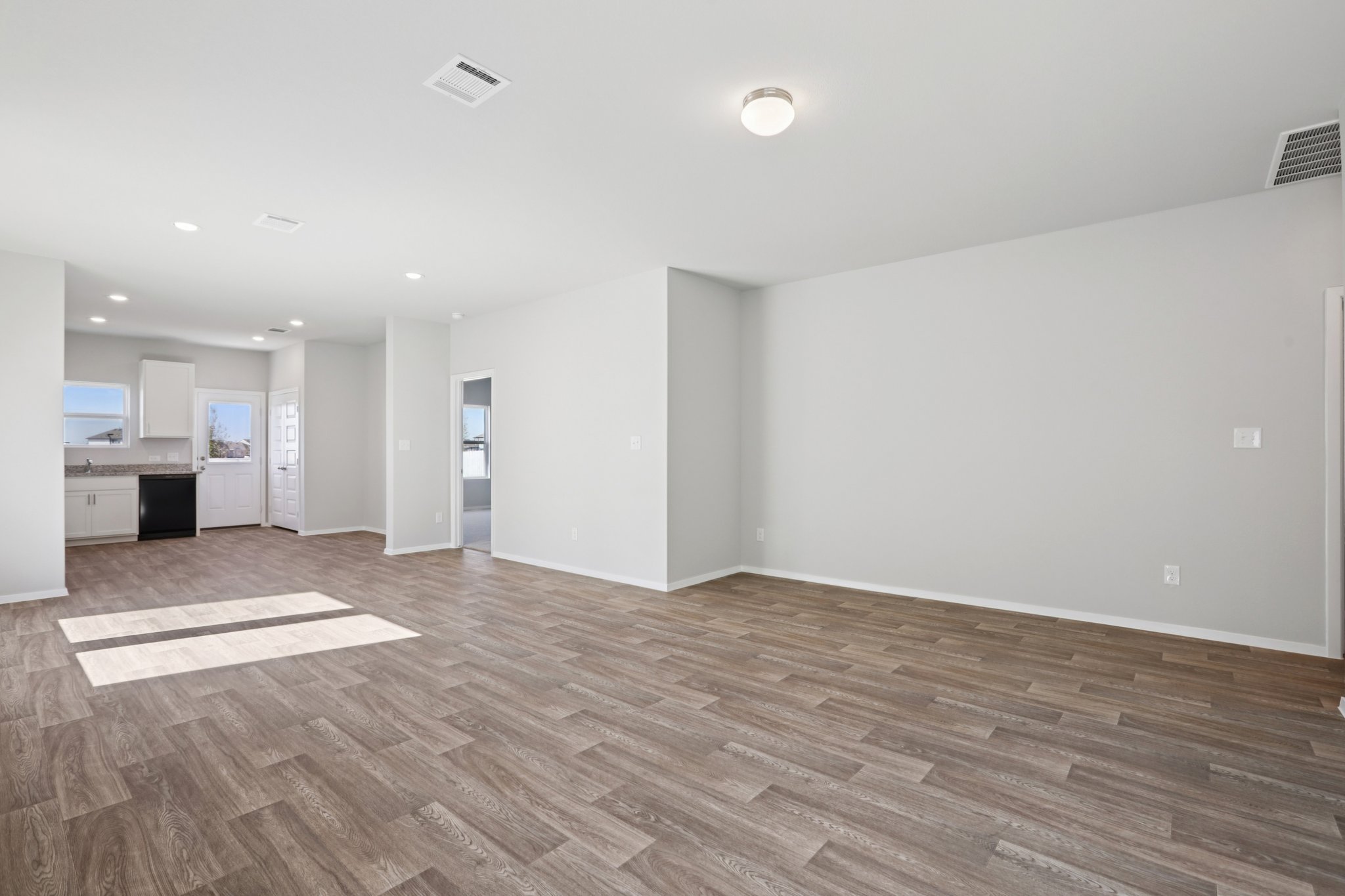 134 Summer Drive Elgin, TX 78621 - Photo 15 of 40 From Family Room to Open Concept Kitchen