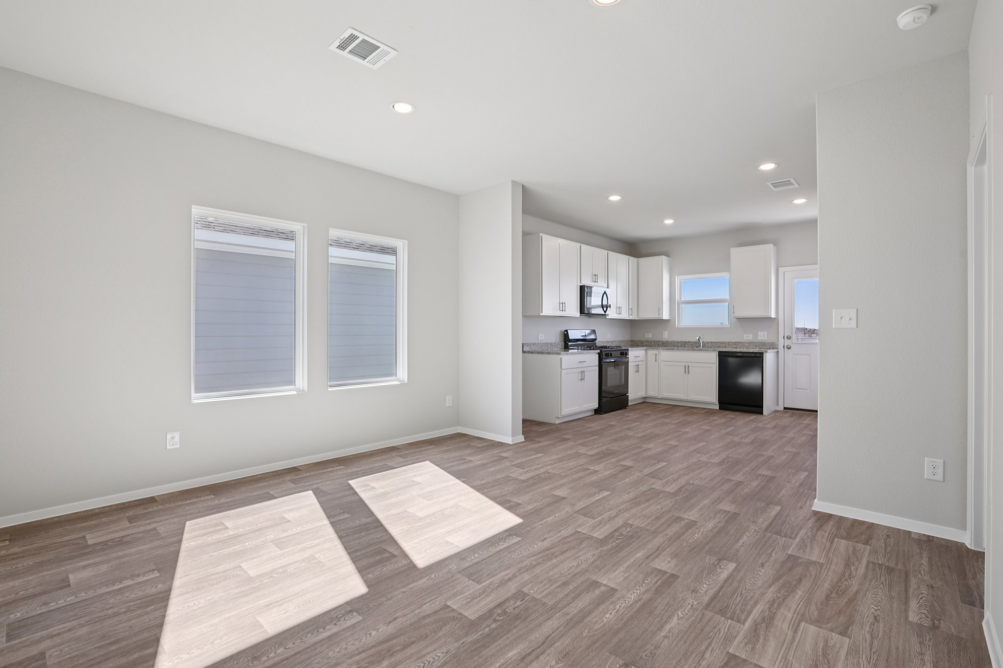 134 Summer Drive Elgin, TX 78621 - Photo 7 of 40 From Family Room to Open Concept Kitchen