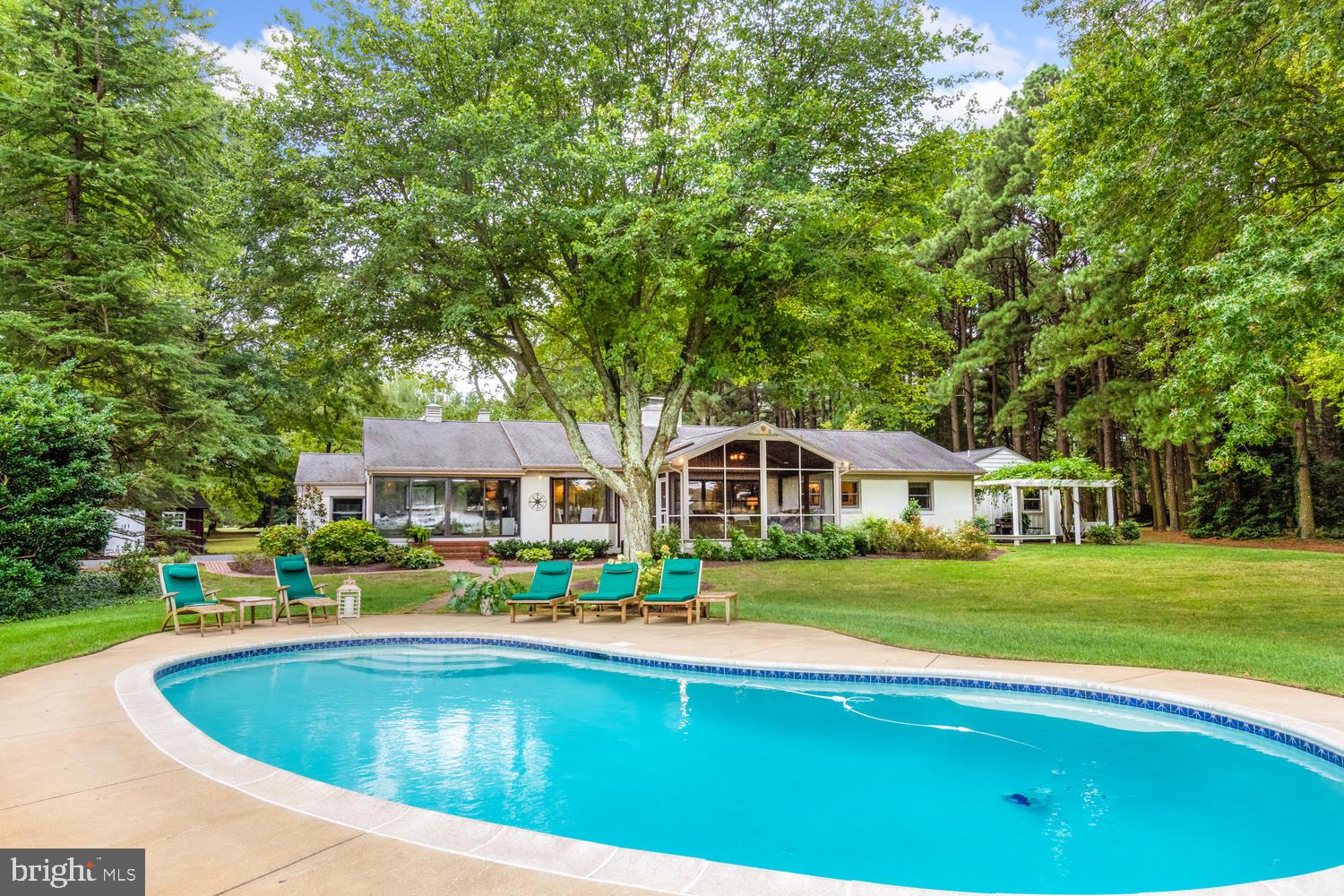 9698 Leeds Landing Road Easton, MD 21601 - Photo 1 of 49 Heated salt water pool view to back of house