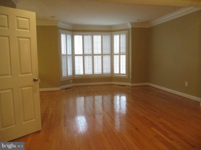3547 Goddard Way Alexandria, VA 22304 - Photo 12 of 38 a view of an empty room with wooden floor and a window