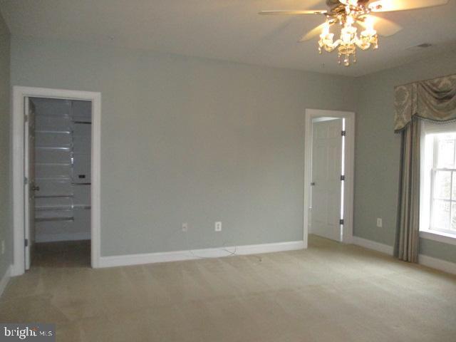 3547 Goddard Way Alexandria, VA 22304 - Photo 21 of 38 an empty room with chandelier fan and windows