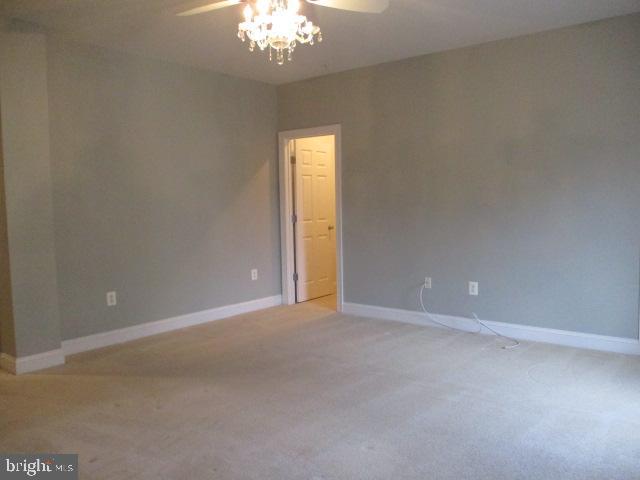 3547 Goddard Way Alexandria, VA 22304 - Photo 23 of 38 a view of an empty room with a chandelier fan