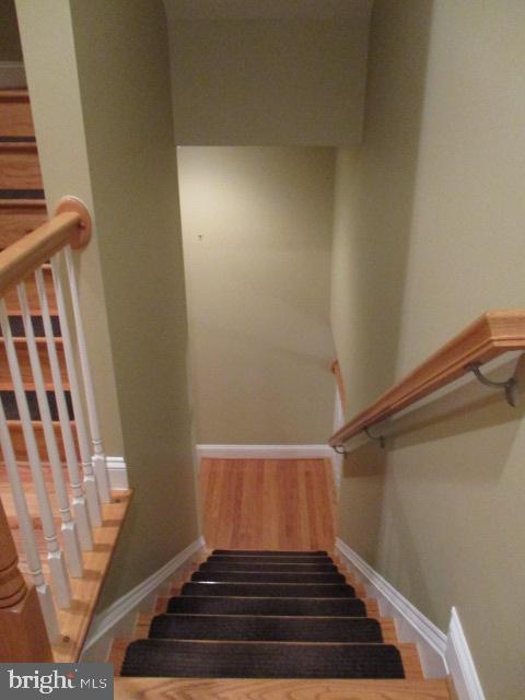 3547 Goddard Way Alexandria, VA 22304 - Photo 10 of 38 a view of a hallway with wooden floor and staircase