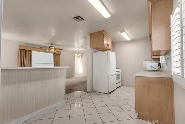a view of storage and utility room with washer and dryer