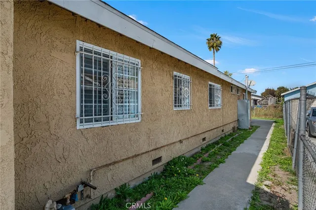 a view of a house with a yard and a garage