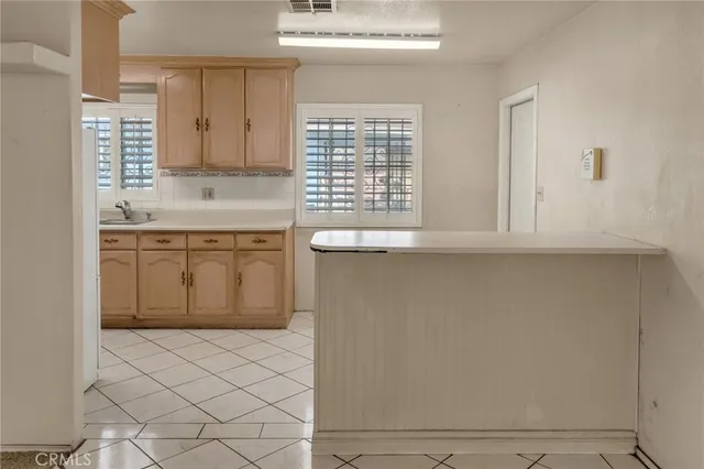 a kitchen with stainless steel appliances granite countertop a sink and a stove