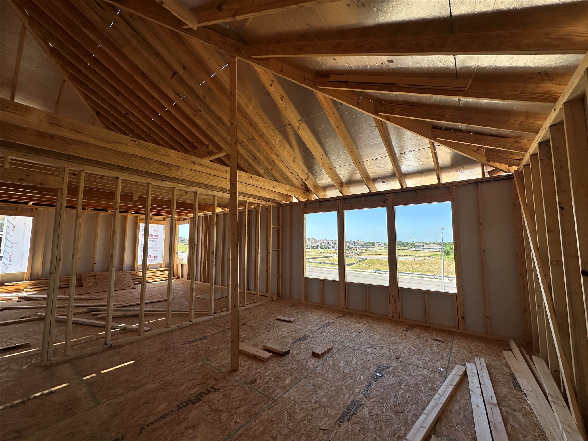 25517 Flora Bella Lane Elgin, TX 78621 - Photo 2 of 33 The framed construction of this dwelling hints at future possibilities with open spaces and plentiful natural light.