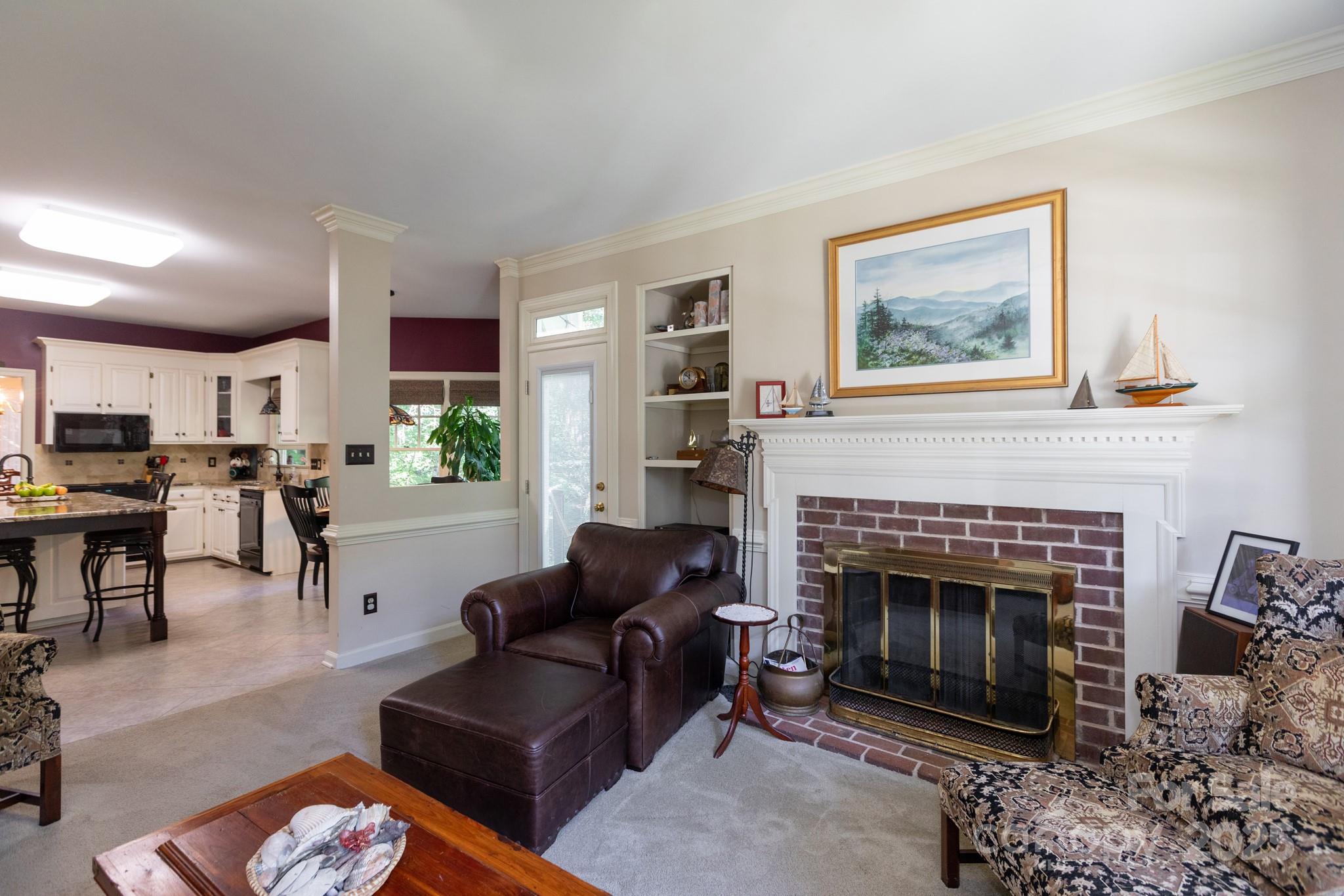 9112 Laurel Ridge Trail Charlotte, NC 28269 - Photo 11 of 38 a living room with furniture a window and a fireplace