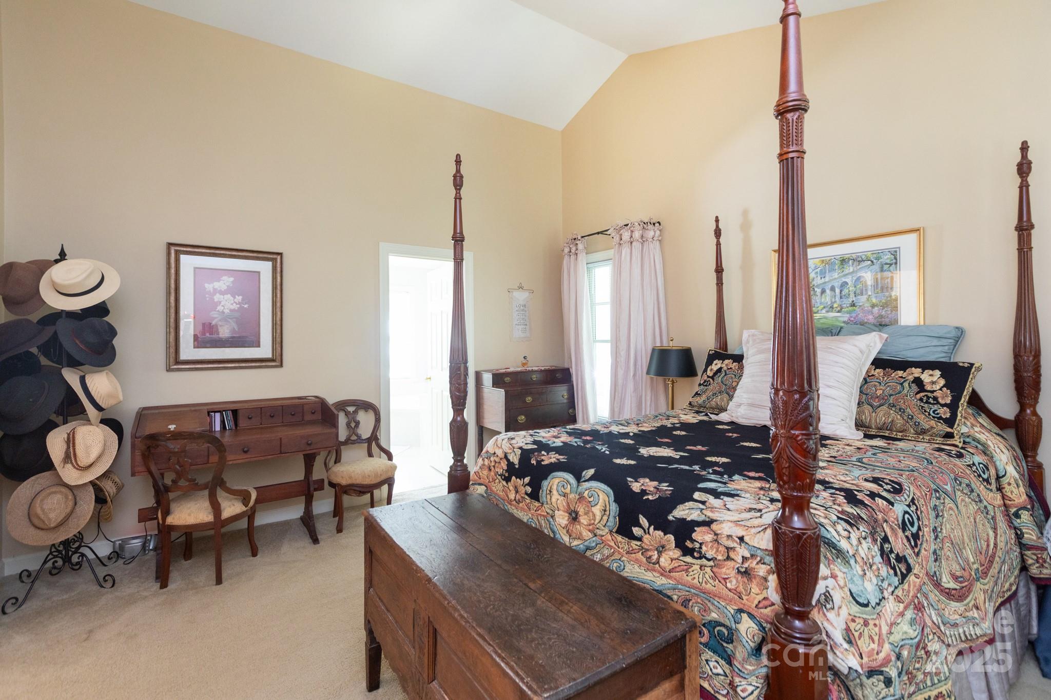 9112 Laurel Ridge Trail Charlotte, NC 28269 - Photo 15 of 38 a bedroom with furniture and a chandelier