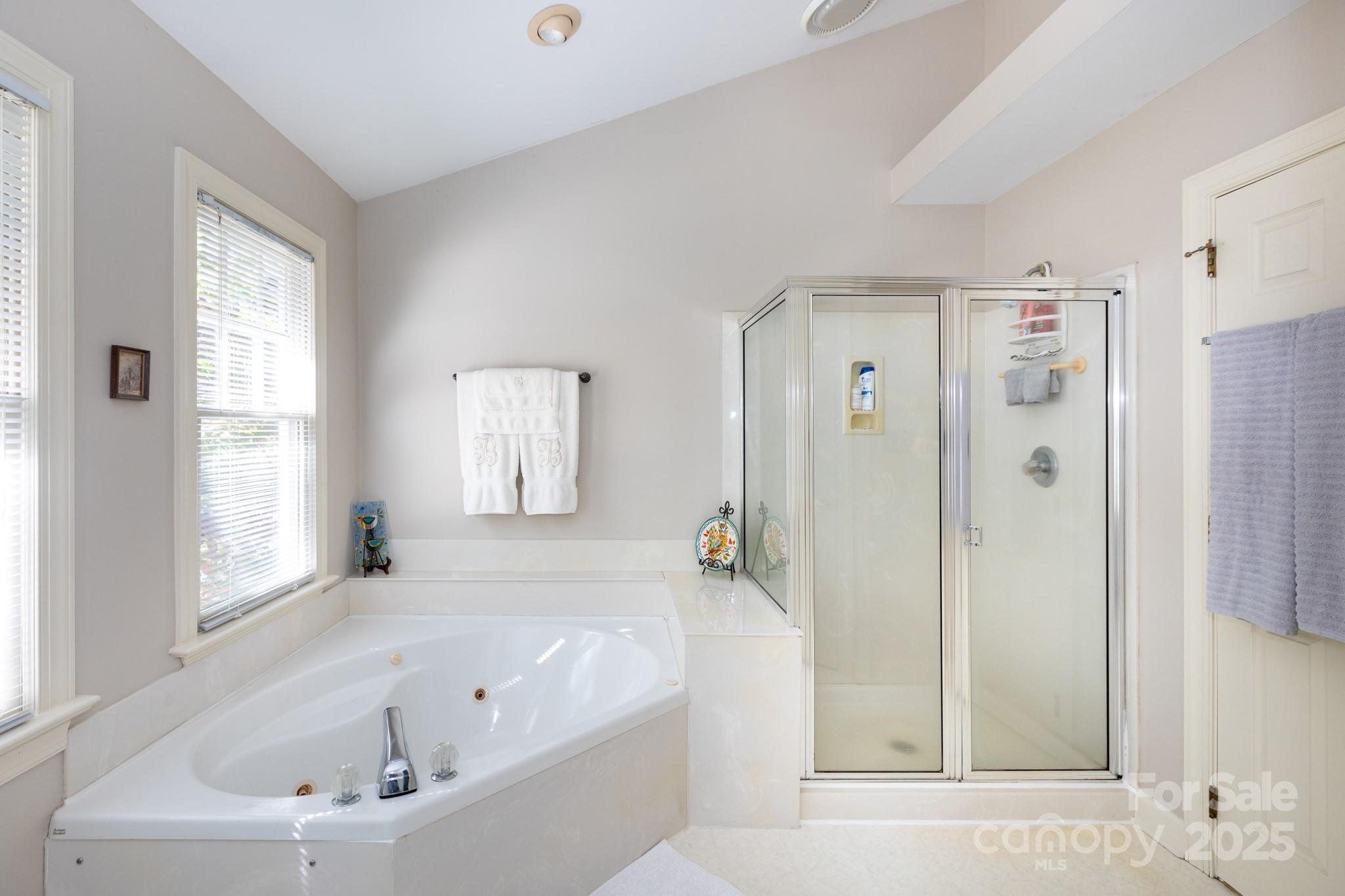 9112 Laurel Ridge Trail Charlotte, NC 28269 - Photo 17 of 38 a bathroom with a bathtub and a shower