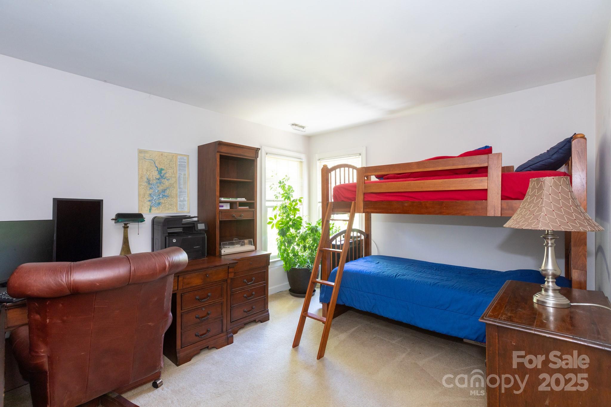 9112 Laurel Ridge Trail Charlotte, NC 28269 - Photo 19 of 38 a living room with furniture and a lamp