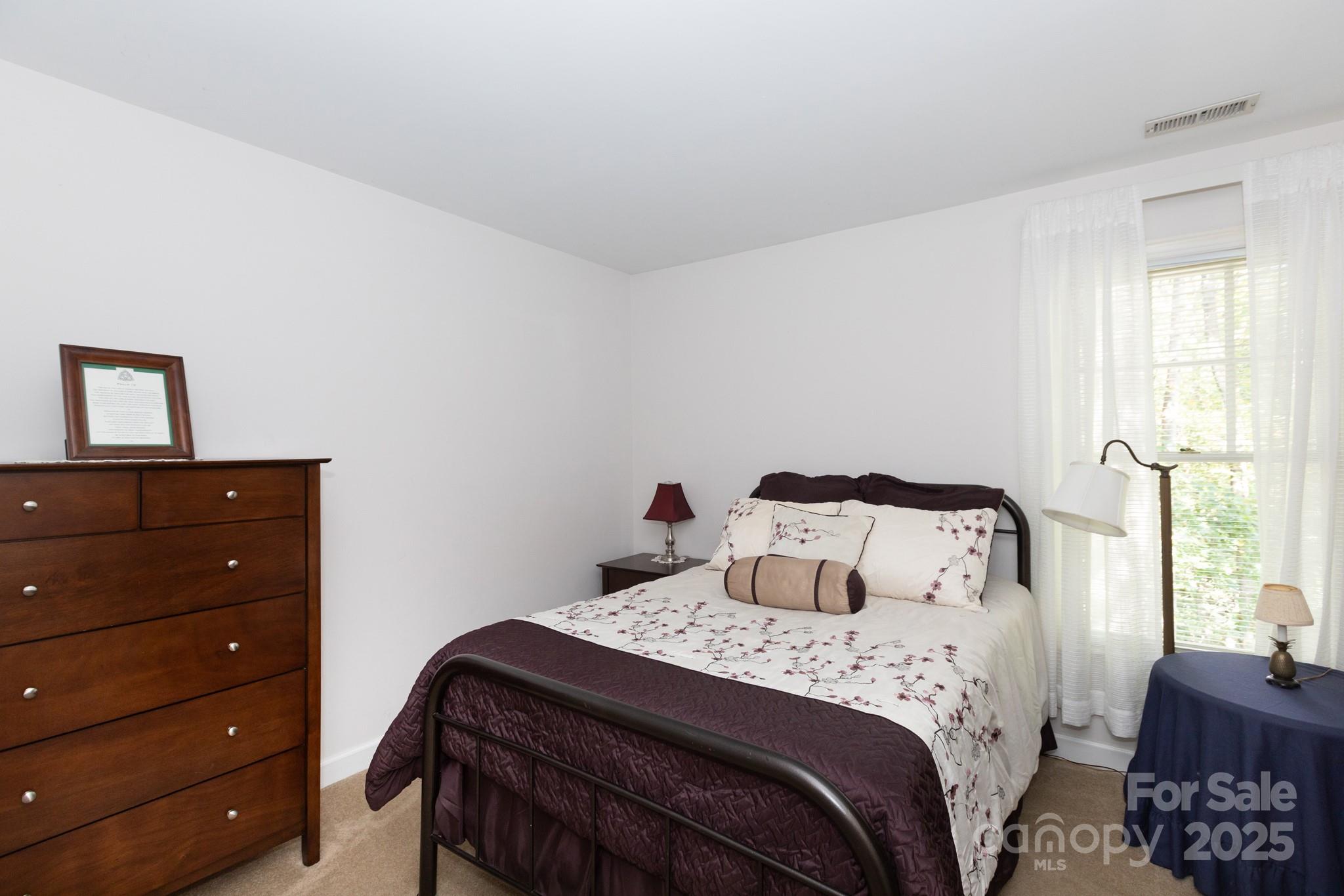 9112 Laurel Ridge Trail Charlotte, NC 28269 - Photo 20 of 38 a bedroom with a bed and a window