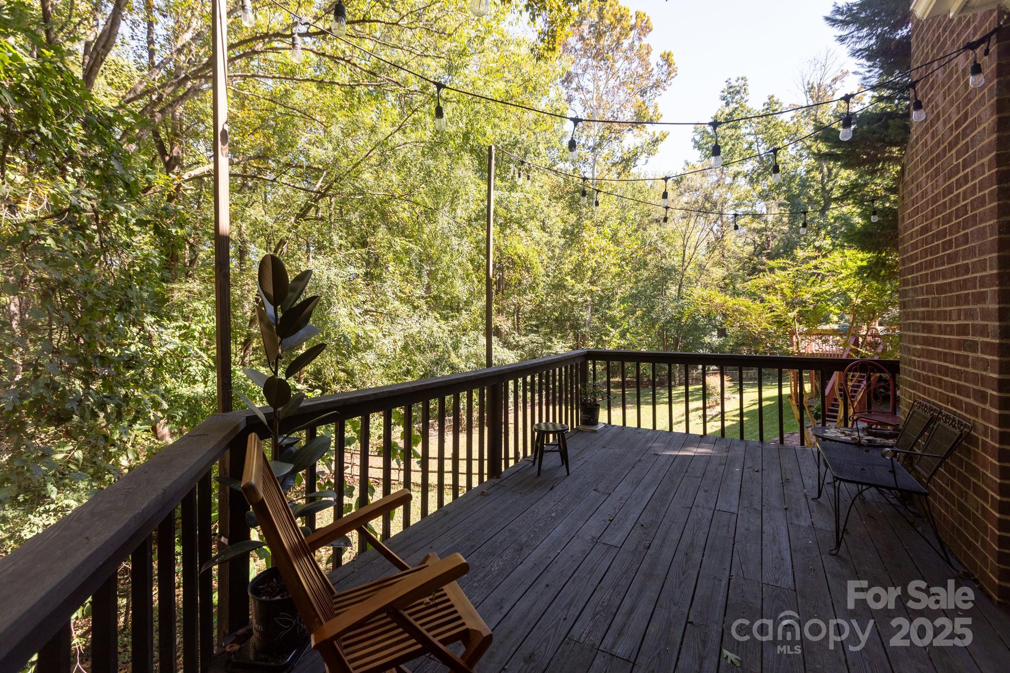 9112 Laurel Ridge Trail Charlotte, NC 28269 - Photo 23 of 38 a balcony with wooden floor and fence