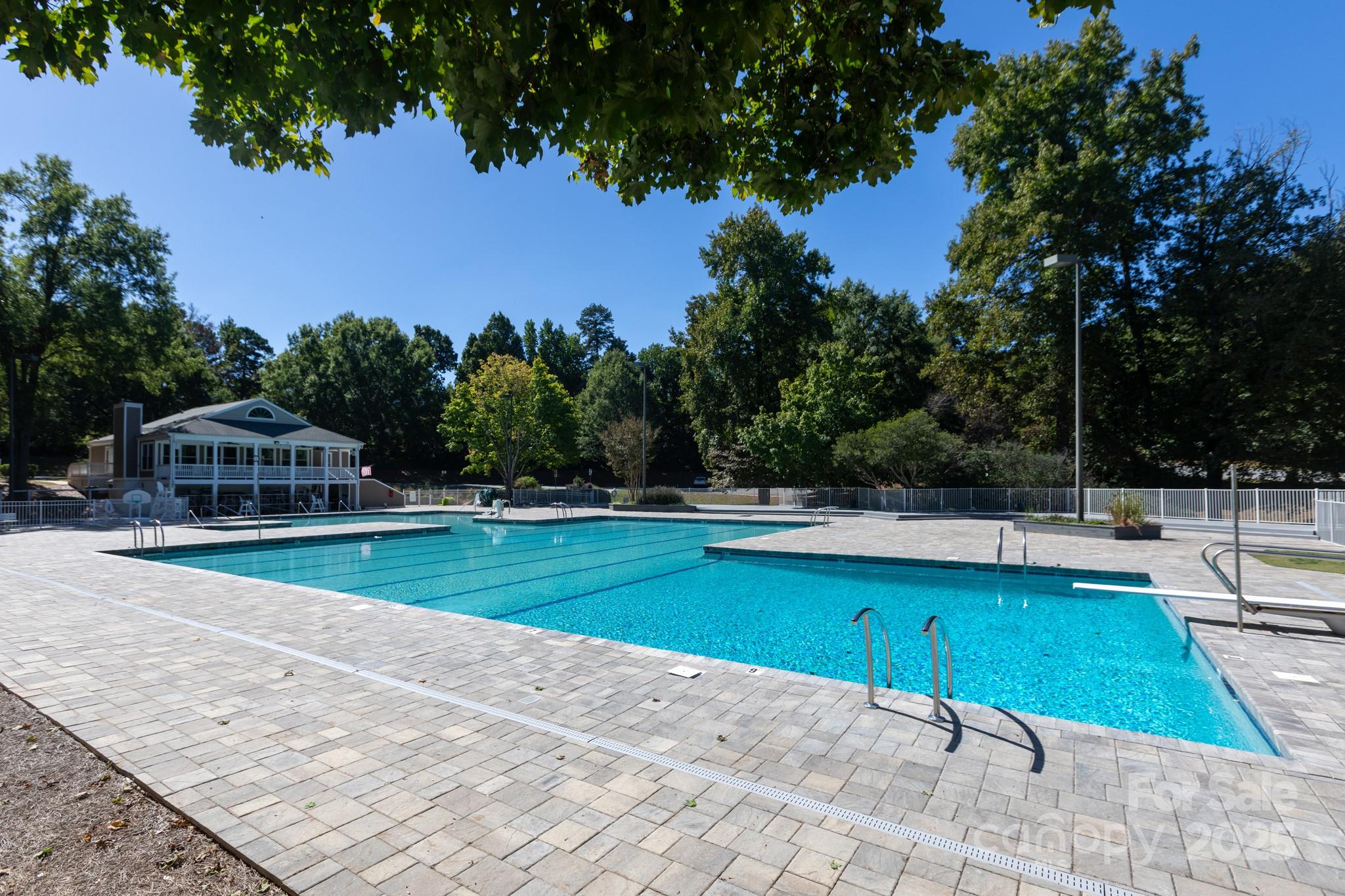 9112 Laurel Ridge Trail Charlotte, NC 28269 - Photo 25 of 38 a view of a swimming pool and lounge chairs in the patio