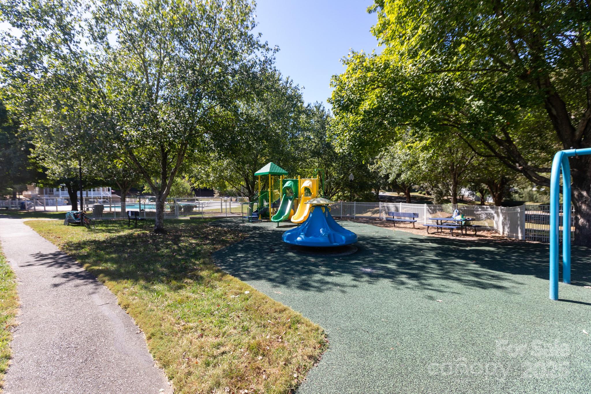 9112 Laurel Ridge Trail Charlotte, NC 28269 - Photo 27 of 38 a view of a park with swings and slides
