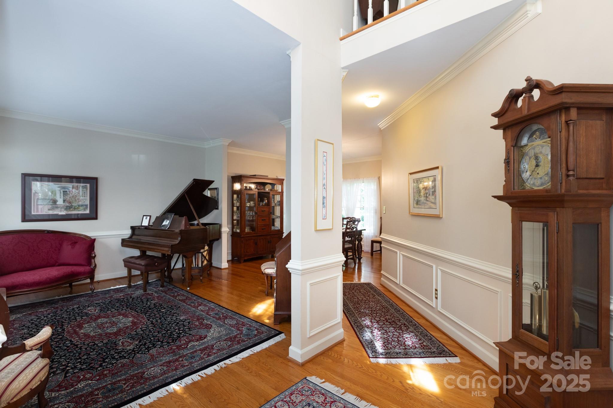 9112 Laurel Ridge Trail Charlotte, NC 28269 - Photo 4 of 38 a living room with furniture and a wooden floor
