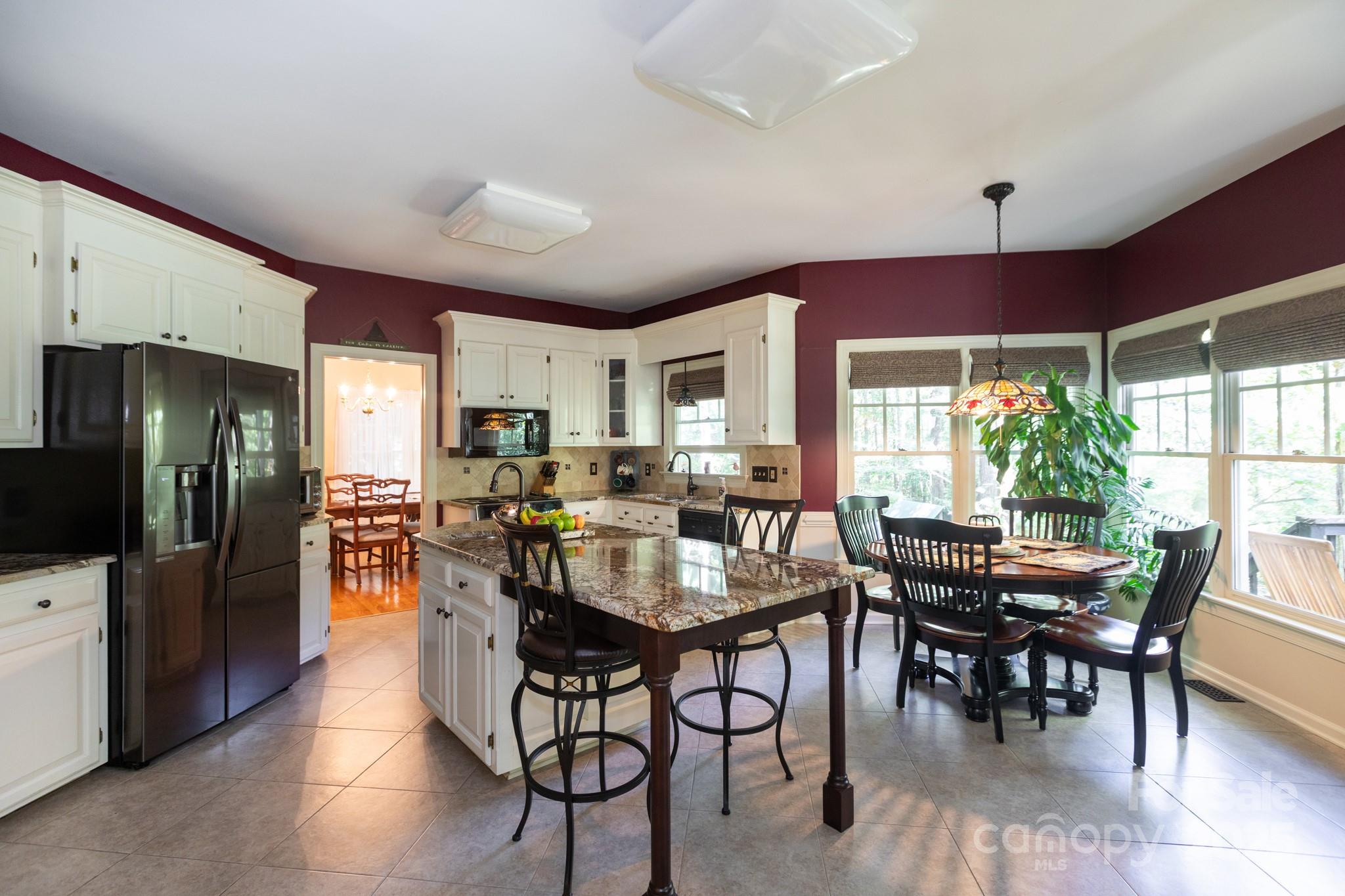 9112 Laurel Ridge Trail Charlotte, NC 28269 - Photo 8 of 38 a view of a dining room with furniture window and outside view