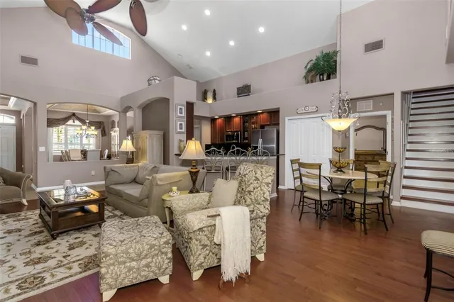 a living room with fireplace furniture and a wooden floor