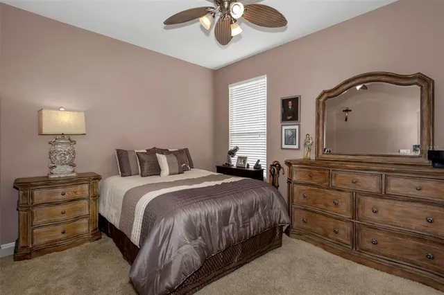 a bedroom with a bed and a dresser