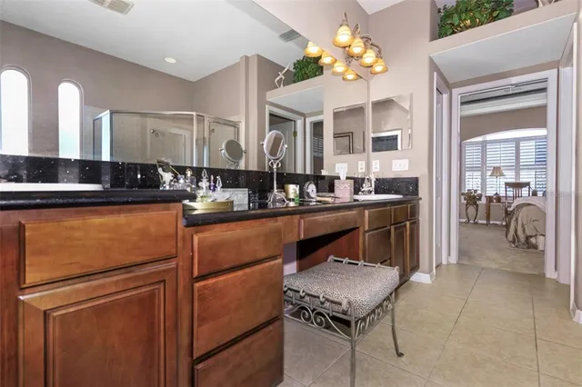 a kitchen with a refrigerator and a sink