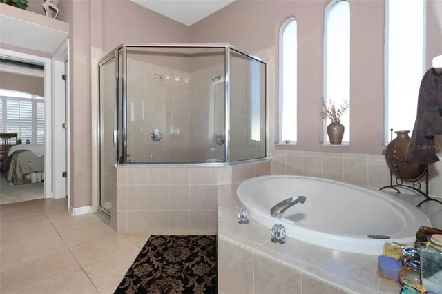 a bathroom with a tub and a shower