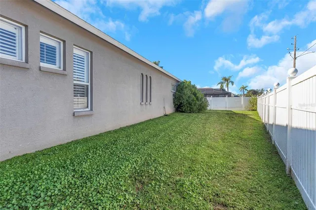 a view of a backyard with potted plants