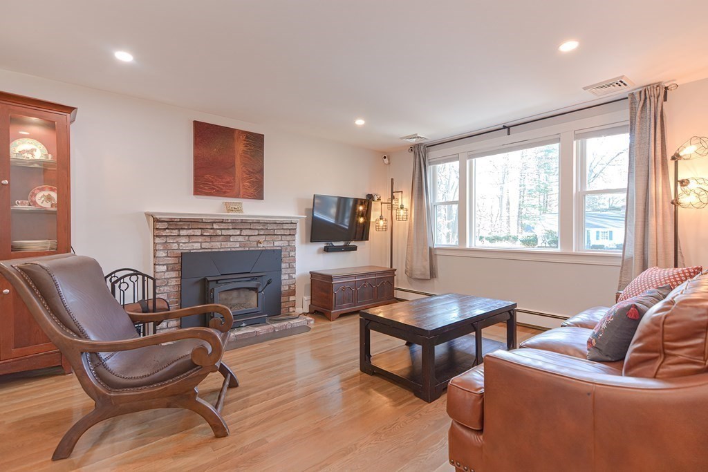 14 Oakcrest Drive Framingham, MA 01701 - Photo 12 of 42 a living room with furniture and a fireplace