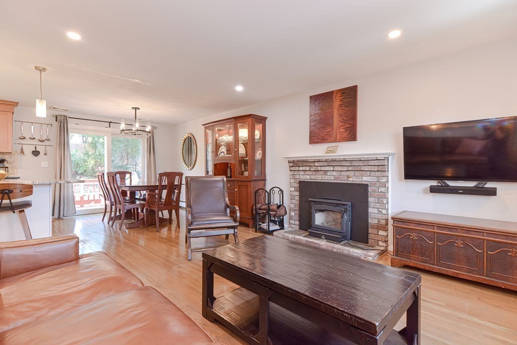 14 Oakcrest Drive Framingham, MA 01701 - Photo 13 of 42 a living room with furniture a flat screen tv and a fireplace
